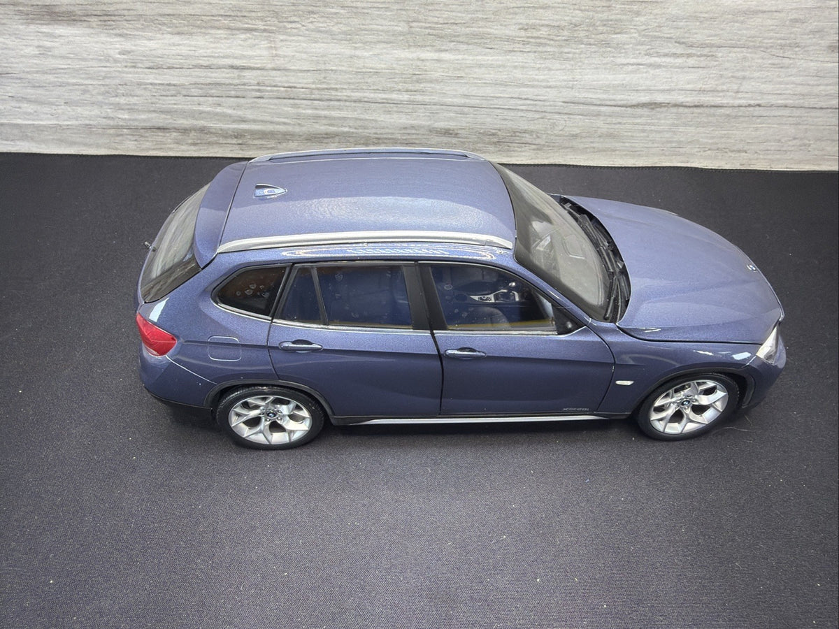 BMW X1 E84, 1:18 Scale Die-Cast Mode Blue , Kyosho  Mirror Damage No Box1