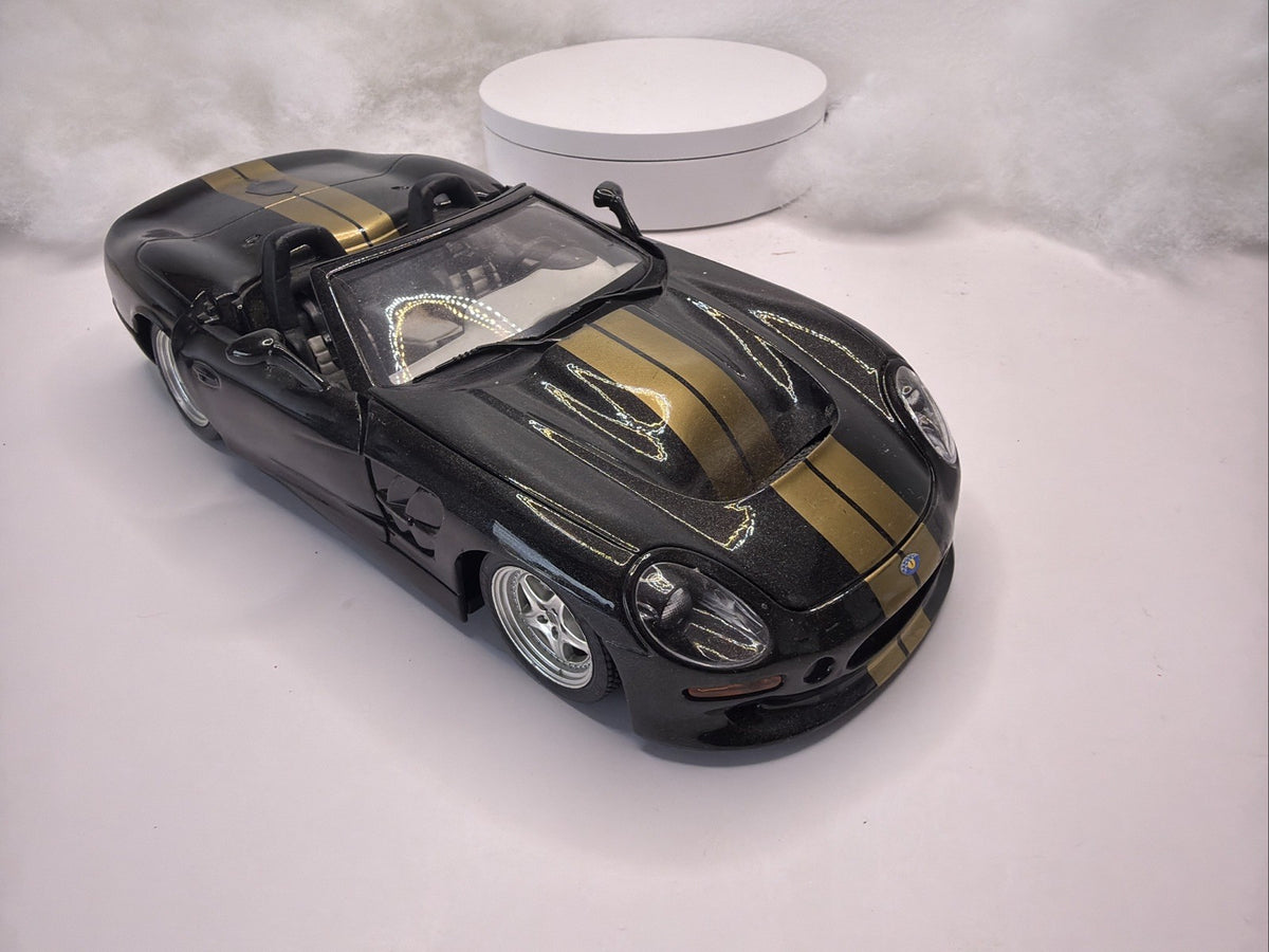 BURAGO 1999 SHELBY SERIES 1  1/18 SCALE DIE CAST BLACK And Gold Light Danage9