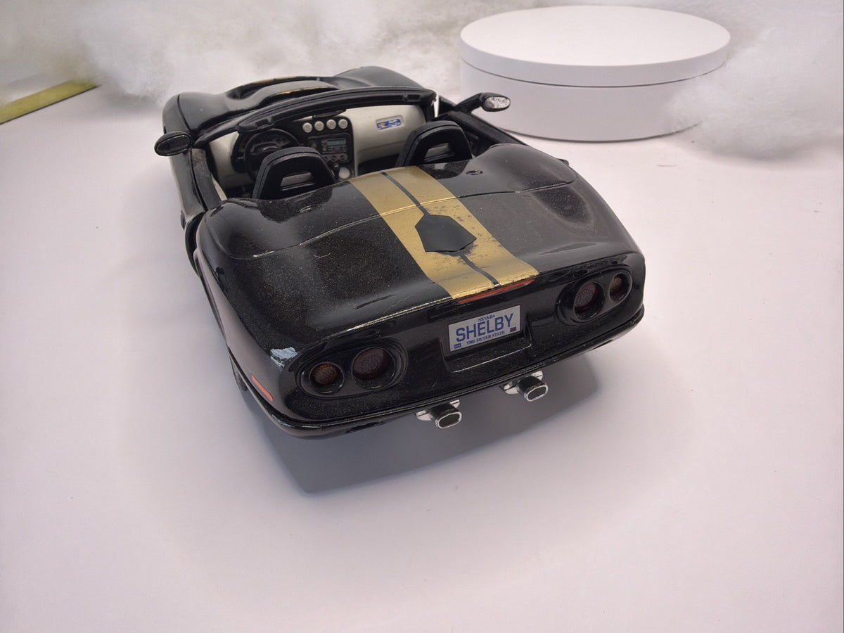 BURAGO 1999 SHELBY SERIES 1  1/18 SCALE DIE CAST BLACK And Gold Light Danage5