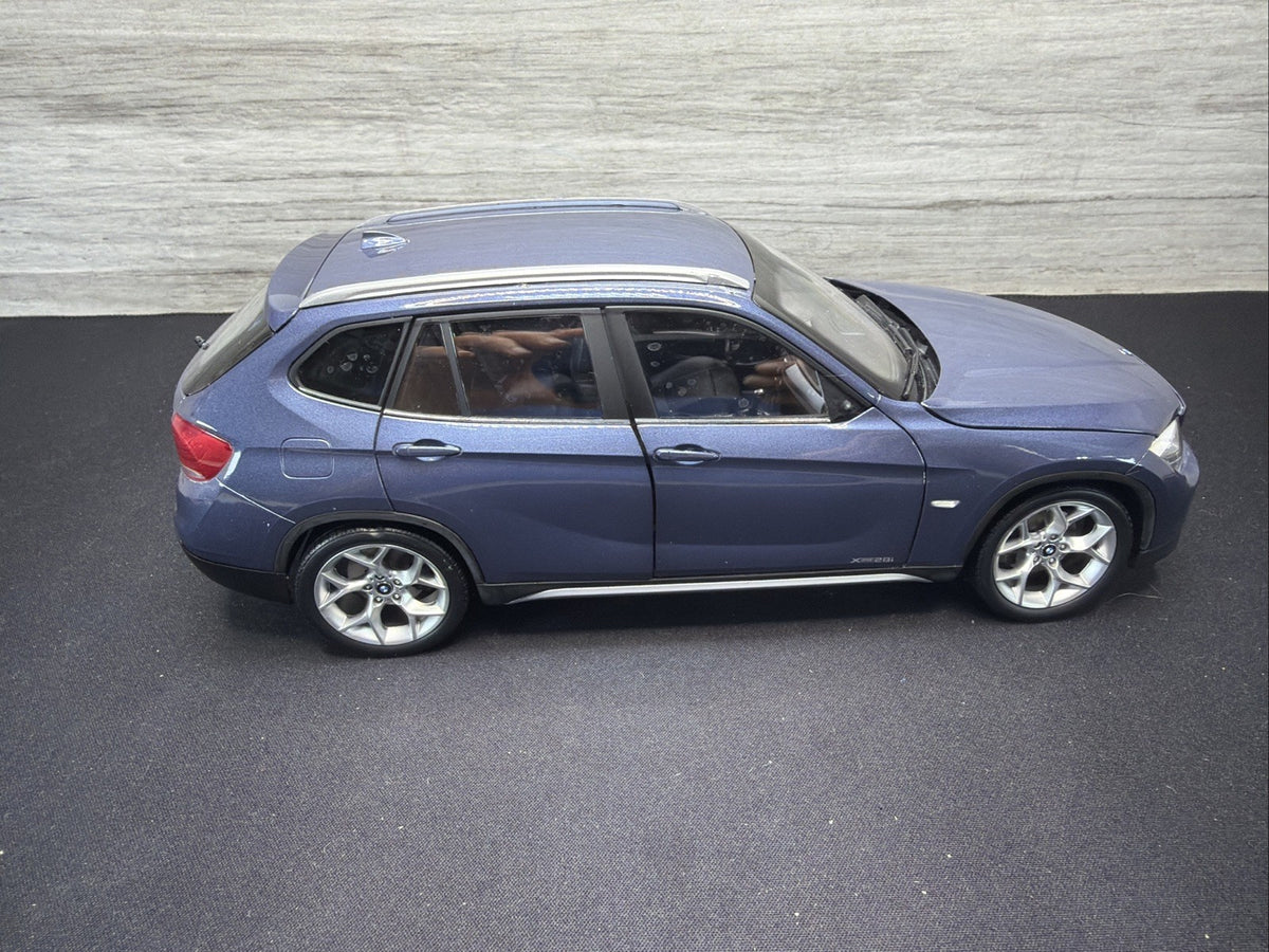 BMW X1 E84, 1:18 Scale Die-Cast Mode Blue , Kyosho  Mirror Damage No Box0